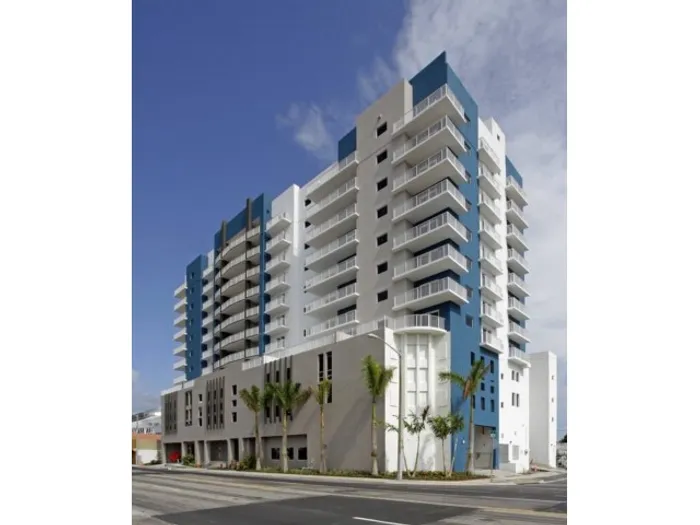 Stadium Tower Exterior | Full shot of building | Palm trees | Street view | Several stories tall