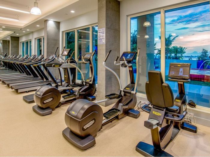 Miami Bay Waterfront Midtown Residences, interior, fitness center, elliptical, treadmills, large window,