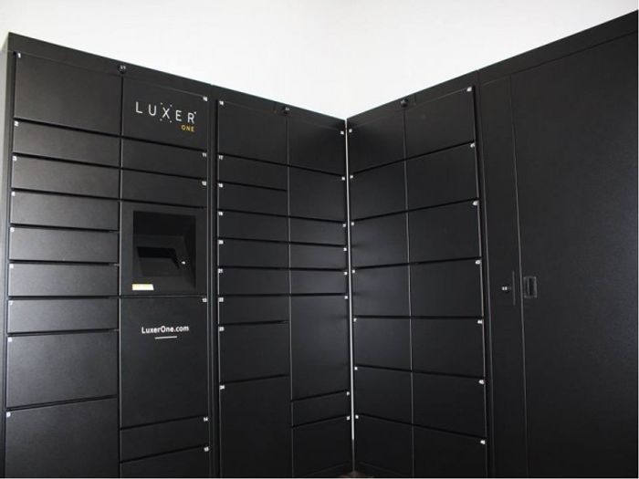 Colony at Dadeland Interior | Package retrieval room | Several lockers | Luxer package system