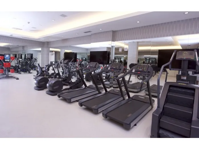 Brickell West City Rentals Interior | Fitness Center | Ver many pieces of cardio workout equipment | Treadmills | Mirror on wall