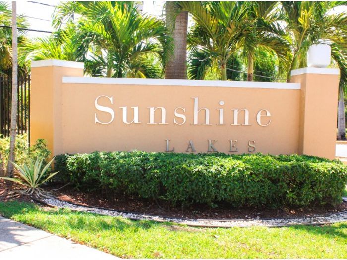 Sunshine Lakes Exterior | Front Sign on wall