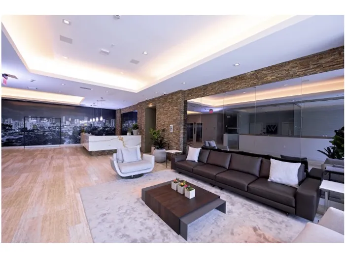 Brickell West City Rentals Interior | Lobby | Concierge desk in back | Couches and coffee table