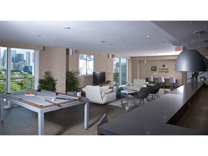 Brickell West City Rentals Interior | Clubhouse | TV and couches | Billiards | Bar