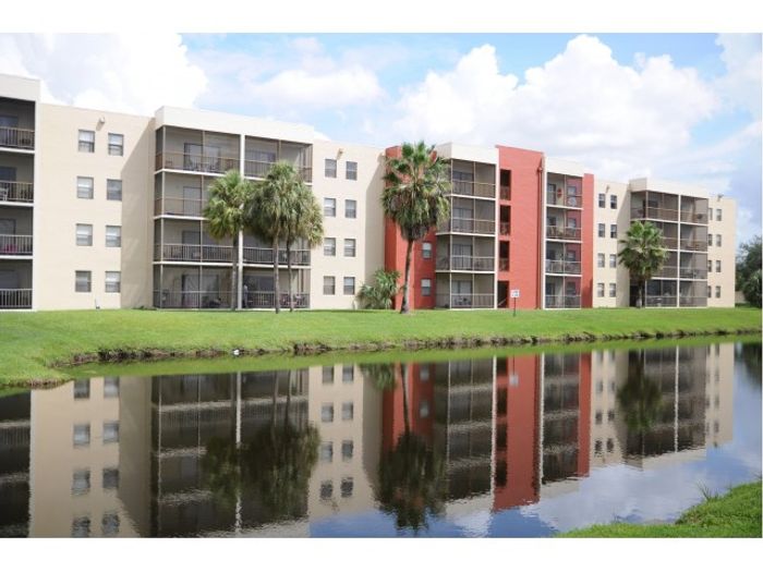 2500 Inverrary Club Apartments, exterior, buildings, pond, palm trees, grass
