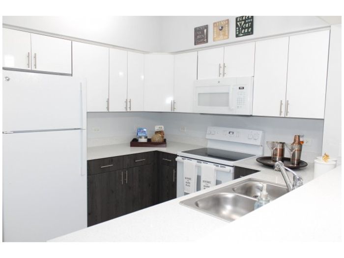 Miami Riverfront Residences, interior, kitchen, two toned cabinetry, quartz countertops, microwave