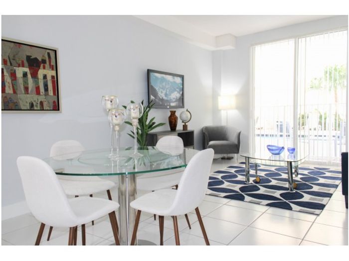 Miami Riverfront Residences, interior, spacious open kitchen, dining, living room, tile flooring, while cabinets and appliances,
