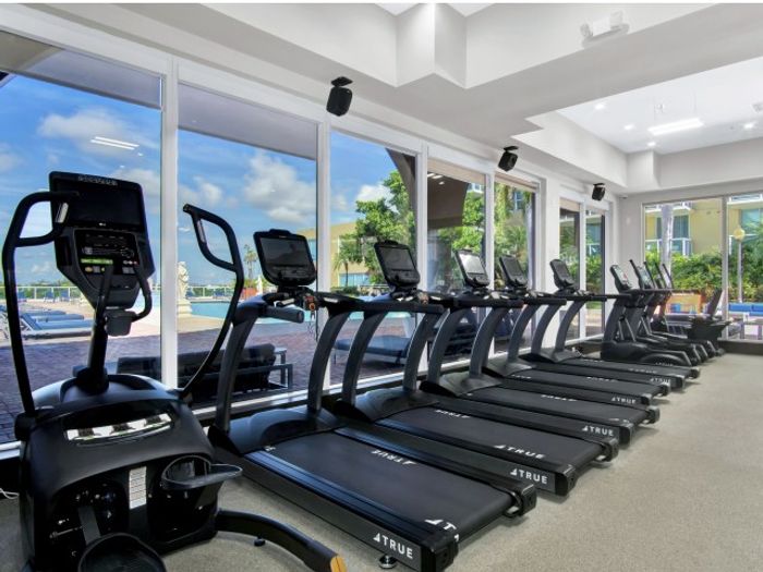 Intracoastal Yacht Club, interior, fitness center, weight machines, large windows