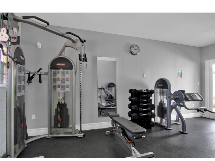 Las Brisas Gardens Apartments, interior, fitness center, weight machines,