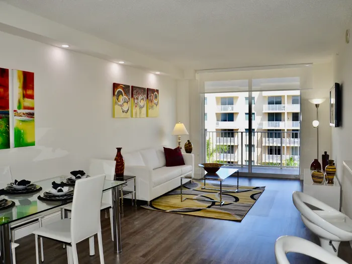 Royal Palms Apartments, interior, living room, tiled flooring, large sliding glass door to balcony