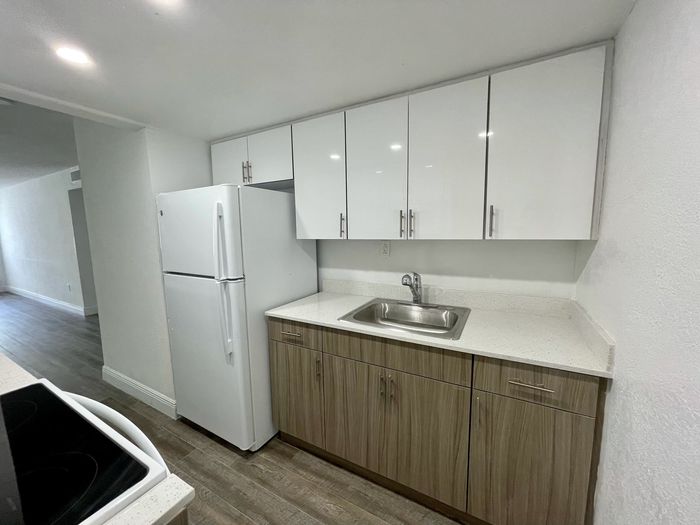 Las Brisas Gardens Apartments, interior, white kitchen, quartz counter tops, white appliances, microwave, stove/oven