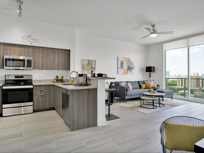 1 Bedroom - Model Unit | Large Bathrooms with Shower Glass Enclosures | Italian Kitchens Complete with Breakfast Bar, Walnut Cabinetry, and Stainless Steel Appliances