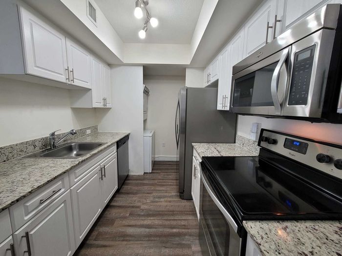 Kitchen with Granite countertops and Stainless Steel Appliances