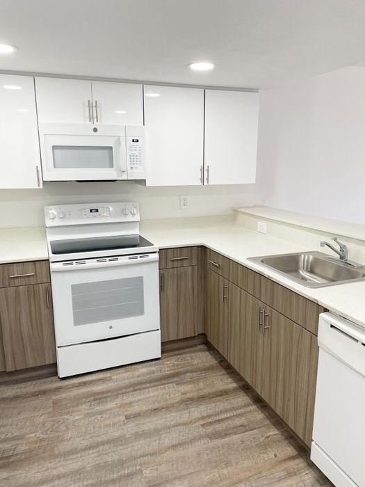 Royalton on The Green Interior | Kitchen | White appliances | Overhead cabinets | Counter all around