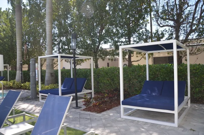 Gables 37 Grand, exterior, jacuzzi, trees, lounge chairs
