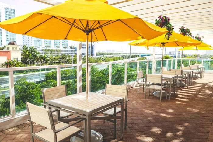 BBQ Area tables with shade and umbrellas