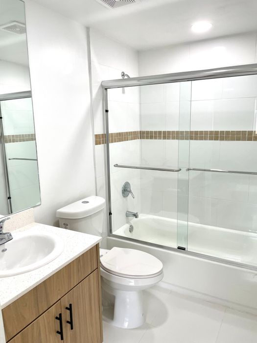 Bathroom with Tub and Glass Doors