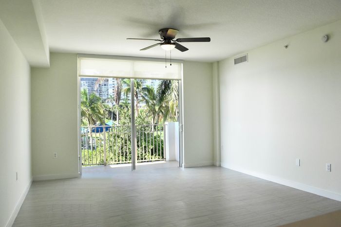 Spacious Living Area with Ceiling Fans