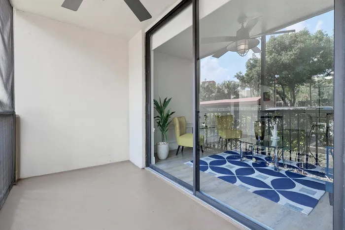Bright balcony space with sliding glass doors