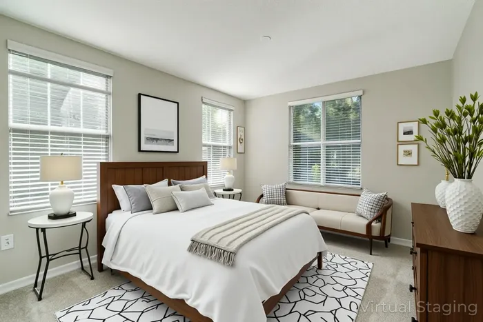 Bright and inviting bedroom with a modern wooden bed, plush pillows, and stylish decor. Sunlit windows and elegant furnishings create a cozy and welcoming atmosphere.