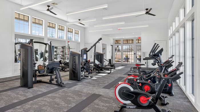 Modern and spacious fitness center with state-of-the-art equipment and natural lighting.