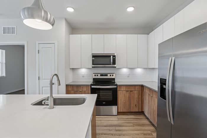Kitchen at Mosaic at Lake Toho apartments - photo 6
