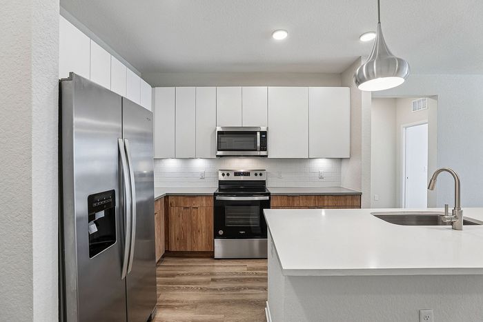 Kitchen at Mosaic at Lake Toho apartments - photo 7