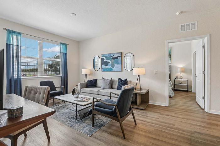 Modern living room at Mosaic at Lake Toho apartments