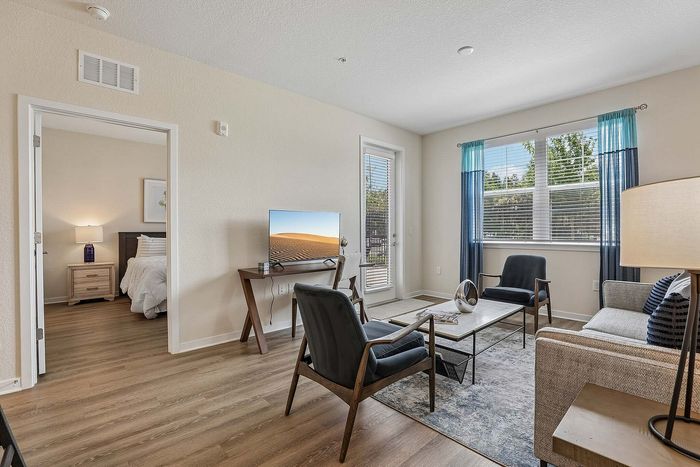 Bright living room at Mosaic at Lake Toho apartments