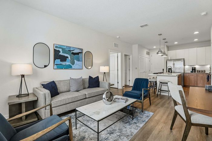 Open-concept living area in a Kissimmee, FL apartment at Mosaic at Lake Toho
