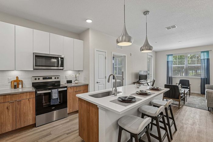 Modern kitchen at Mosaic at Lake Toho apartments in Kissimmee, FL