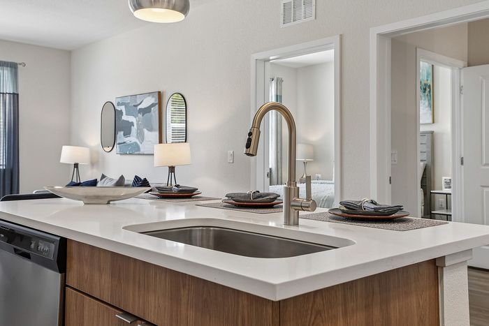 Kitchen island at Mosaic at Lake Toho apartments