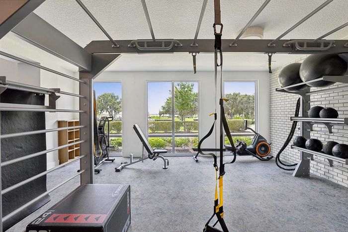 Fitness center at Mosaic at Lake Toho apartments - photo 2