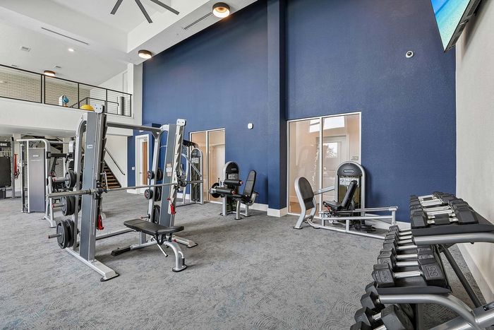 Fitness center at Mosaic at Lake Toho apartments - photo 5