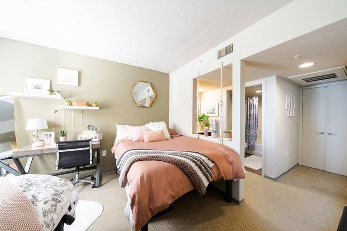 Bedroom with furnishings | University Gateway Apartments in Los Angeles, CA.