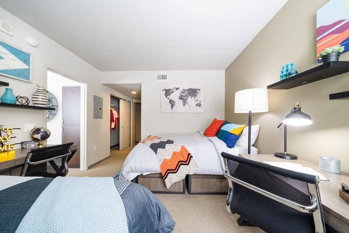 Shared bedroom with double desks  | University Gateway Apartments in Los Angeles, CA.