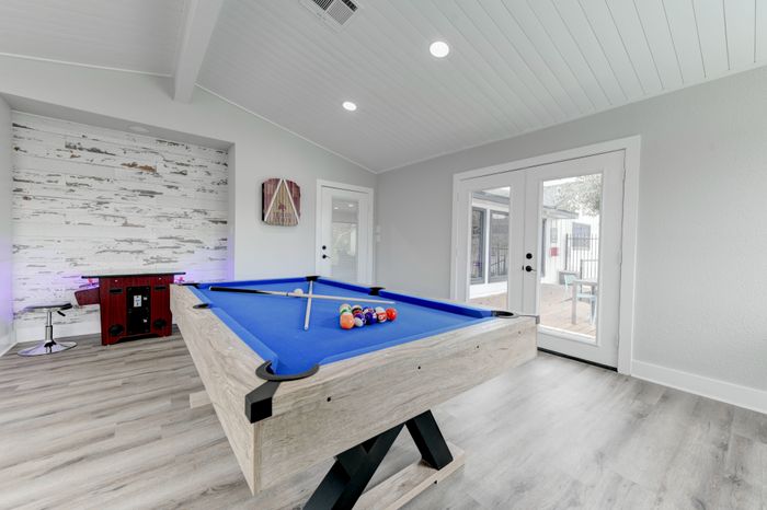 Billiards table in spacious clubhouse at  at The Timbers apartments