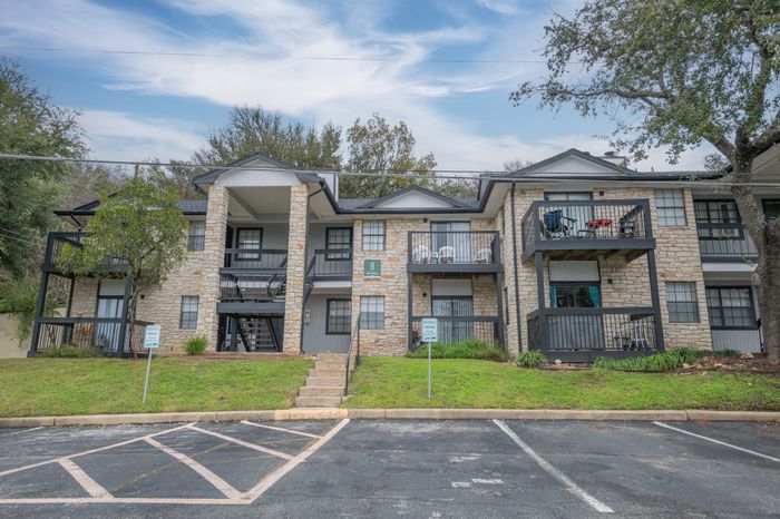 Exterior - building, landscaping, parking  at The Timbers apartments
