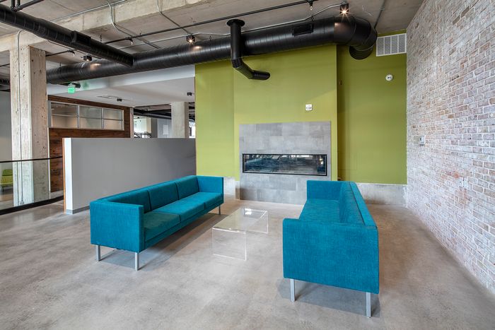 Fire feature with nearby seating in Spacious Resident Club House | Theory Syracuse | Apartments near SU in New York