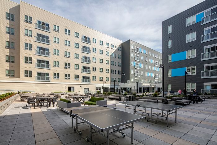 Outdoor game area including ping-pong tables at Theory Syracuse | Apartments near SU in New York