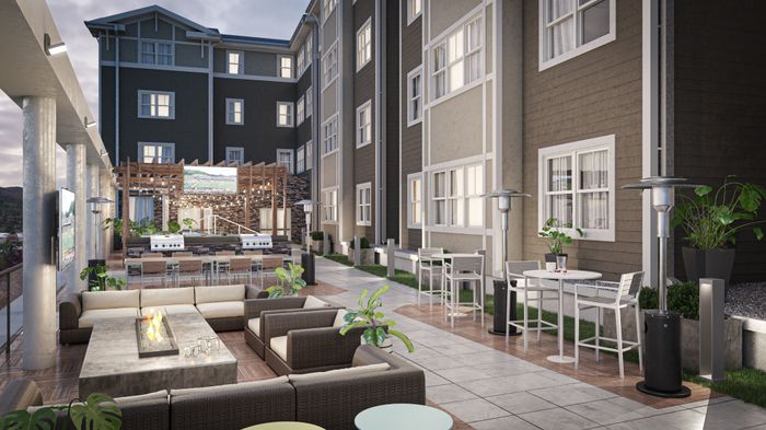 Outdoor Courtyard with seating and fire feature | The Finmore at 241 Apartments