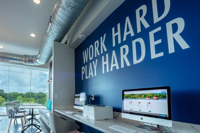 Wall in Business Area "Work Harder Play Harder" The Bluff at Waterwoks Landing | Tuscaloosa, AL Student Apartments