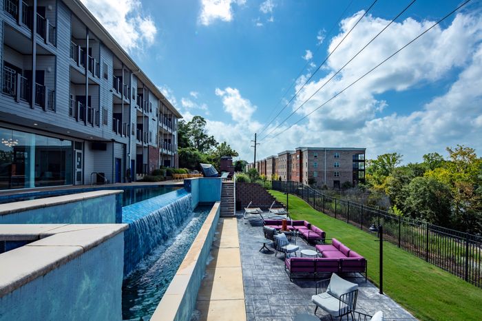 Outdoor Waterfall & Patio Area | The Bluff at Waterwoks Landing | Tuscaloosa, AL Student Apartments