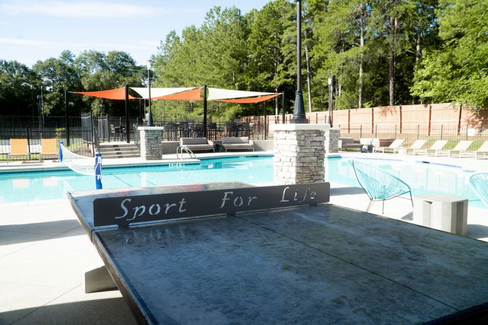 Ping pong table near pool |  Apartments in Clemson, SC | Clemson Edge