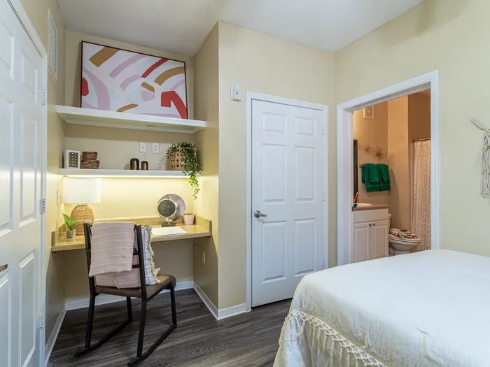 Charming bedroom view | Sizable bed | Draping curtains |  Ceiling fan | Hawks Landing | Apartments in Tampa, FL