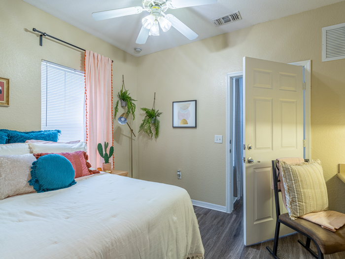 Charming bedroom view | Sizable bed | Draping curtains |  Ceiling fan | Hawks Landing