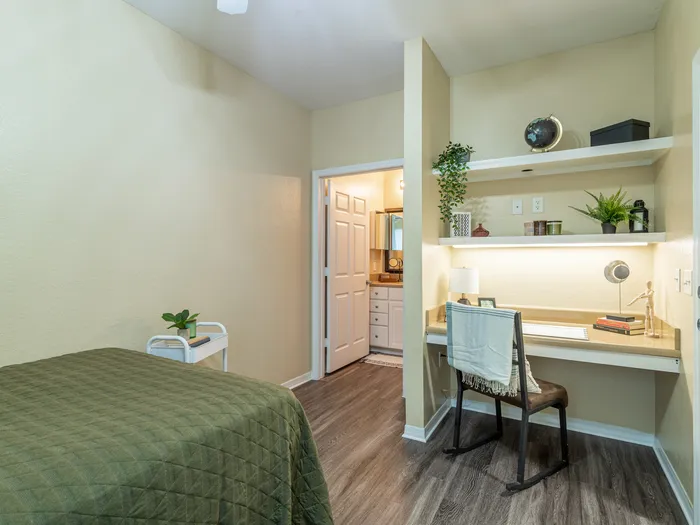 Charming bedroom view | Sizable bed | Draping curtains |  Ceiling fan | Hawks Landing | Apartments in Tampa, FL