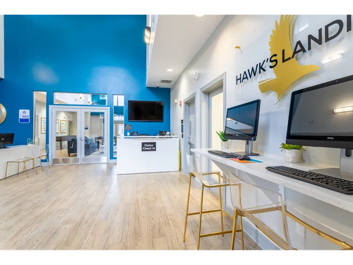 Tidy room full of independent study stations each with their own computer | Hawks Landing Apartments in Tampa, FL