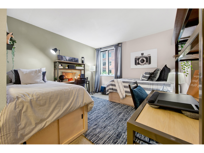 Roomy bedroom with desks  | University Gateway Apartments in Los Angeles, CA.