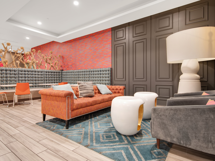 Seating in common area with tables and lamps | University Gateway Apartments in Los Angeles, CA.