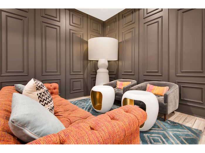Comfortable seating in common area with lamps and tables | University Gateway Apartments in Los Angeles, CA.